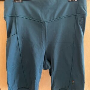 Smartwool blue bike shorts with side and back pockets
